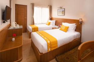 Postel nebo postele na pokoji v ubytování Pema Boutique Hotel