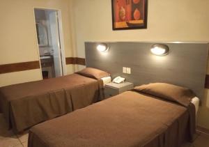Postel nebo postele na pokoji v ubytování Hotel Nontue Abasto Buenos Aires