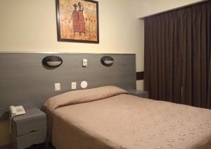 Postel nebo postele na pokoji v ubytování Hotel Nontue Abasto Buenos Aires