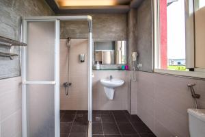 a bathroom with a shower and a sink at Farmland B&B in Guilin +38 photos