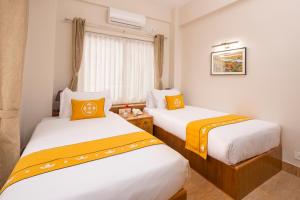 Letto o letti in una camera di Pema Boutique Hotel