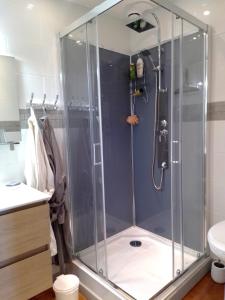 a shower with a glass enclosure in a bathroom at Chez Marie in Dunkerque