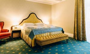 Postel nebo postele na pokoji v ubytování Hotel Bristol