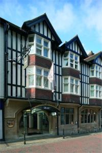 a building with a flag in front of it at ABode Canterbury in Canterbury