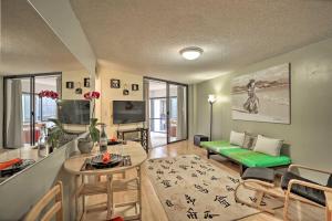 a living room with a couch and a table at Downtown Honolulu Suite Near Ala Moana Beach! in Honolulu