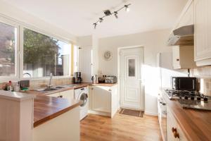 a kitchen with a sink and a dishwasher at Cedar Place in Southwell in Southwell