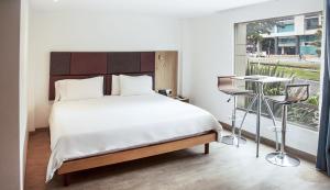 Postel nebo postele na pokoji v ubytování Hotel Viaggio Teleport City Suites + 37 fotografií