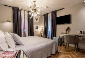 TV a/nebo společenská místnost v ubytování ARTALE 07 Design Rooms