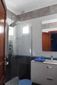 a bathroom with a shower and a toilet and a sink at VILLA DE LA VISTA in Playa Blanca +13 photos