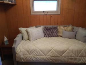 a bed in a room with a window at Bright and Cool Powell Apartment in Powell