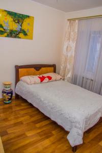 Кровать или кровати в номере Apartment on Malaya Arnautskaya 21