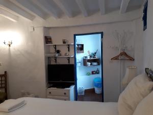 Posteľ alebo postele v izbe v ubytovaní Guesthouse La Tienda Cómpeta 21b