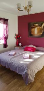 a bedroom with a bed with two towels on it at Mjóanes accommodation in Hallormsstaður