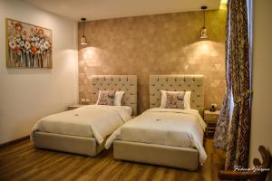 Postel nebo postele na pokoji v ubytování Adamas House Hotel Boutique