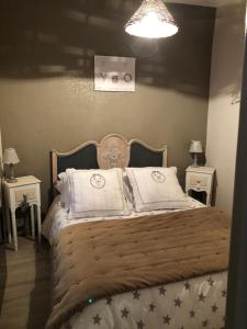 Кровать или кровати в номере gite du moulin
