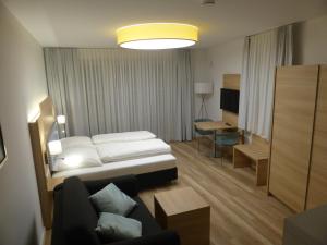 Postel nebo postele na pokoji v ubytování Leister Apparthotel