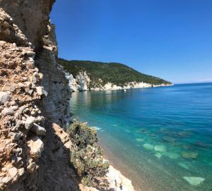 a view of the ocean from a rocky shore at Vignanotica Beach Apartments in Mattinata