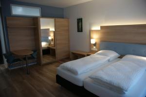 Postel nebo postele na pokoji v ubytování Leister Apparthotel