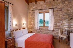 Postel nebo postele na pokoji v ubytování Enastron Villas