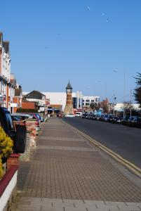 a street with a clock tower on the side of a road at Clarence House in Skegness