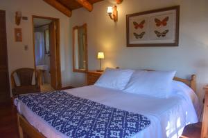 Ein Bett oder Betten in einem Zimmer der Unterkunft Cabañas Monte Verde