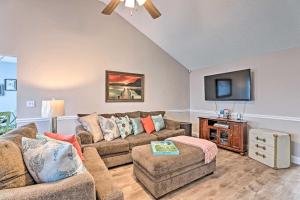 a living room with two couches and a flat screen tv at Beach-Themed Retreat 10 Mi to Downtown Charleston in Charleston