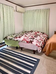 En eller flere senge i et værelse på 船堀ハウス