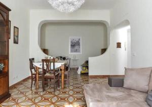 a living room with a table and a couch at La Casa di Eva in Rome