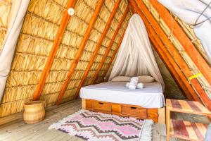 Ένα ή περισσότερα κρεβάτια σε δωμάτιο στο Nílu Puerto Escondido by Selina +27 φωτογραφίες