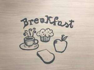 a drawing of a breakfast with a cup of coffee and an apple at B&Bononia View in Bologna