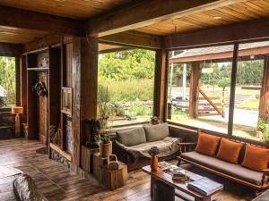 a living room with a couch and a table at Boye House in Futrono