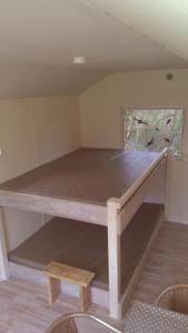 a large wooden table in a room at Treene Camp Horn in Esperstoft