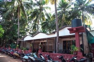 a group of motorcycles parked in front of a building at Patnem Beach Cottages in Patnem