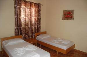 Postel nebo postele na pokoji v ubytování Hotel Ramosaco, Radhimë, Vlorë