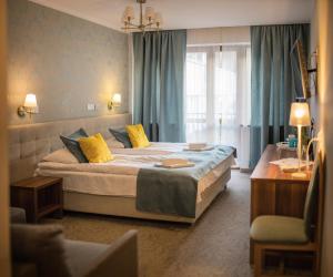 Postel nebo postele na pokoji v ubytování Pod Wzgórzem Bed & Breakfast