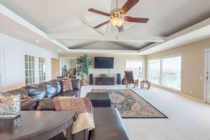 a living room with a couch and a ceiling fan at Whalerock Luxury Home in Trinidad