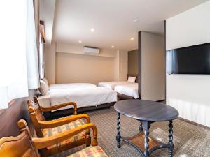 Katil atau katil-katil dalam bilik di Bande Hotel Tenpozan Higashi