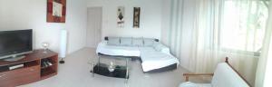 A bed or beds in a room at Luca Apartments