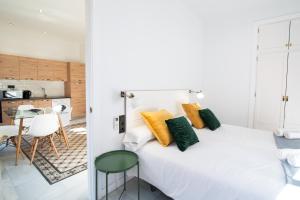 Granadi Apartamentos客房内的一张或多张床位