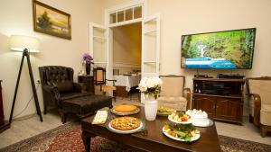 a living room with a table with food on it at Historical Ottoman Manor in Izmir