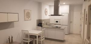 Kuchyň nebo kuchyňský kout v ubytování Apartamento Iceberg Tarifa Parking gratuito