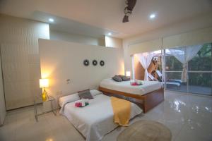 Tempat tidur dalam kamar di Htl & Villas Comala, alberca , parking, céntricas, Petfriendly