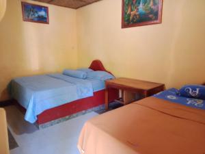 Ένα ή περισσότερα κρεβάτια σε δωμάτιο στο Gani Homestay +48 φωτογραφίες