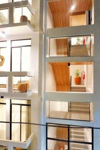 a room with glass shelves in a house at Luxx Boutique Boracay in Boracay