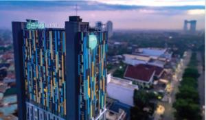 a view of a tall building in a city at Deka Hotel Surabaya HR Muhammad in Surabaya