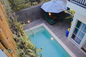 Bazén v ubytování The Green Home Bali nebo v jeho okolí