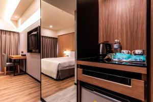 Postel nebo postele na pokoji v ubytování Fish Hotel Kaohsiung
