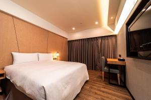 Postel nebo postele na pokoji v ubytování Fish Hotel Kaohsiung