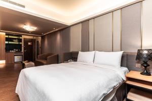 Postel nebo postele na pokoji v ubytování Fish Hotel Kaohsiung