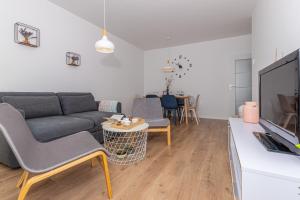 a living room with a couch and a table at Apartment Vivien in Crikvenica